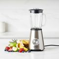 Sleek modern blender on kitchen countertop with fresh fruits